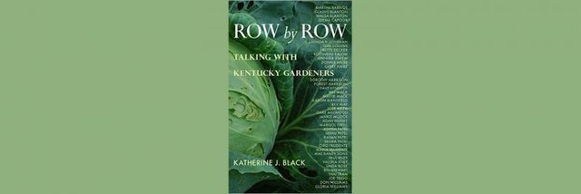 Katherine J. Black signs “Row by Row”